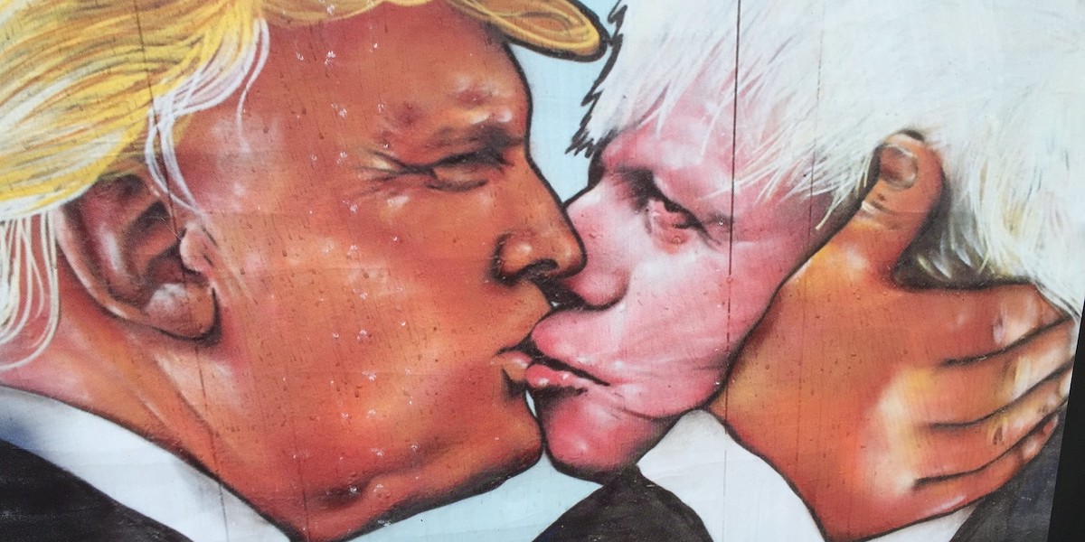 Graffiti showing Donald Trump kissing Boris Johnson