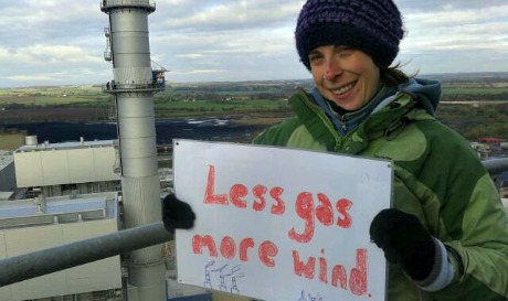 Protester above power station