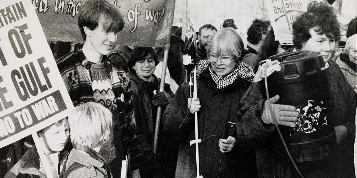 A black and white photo of people protesting against the first Gulf War