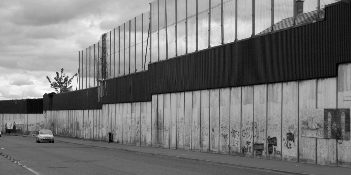 A monochromatic photo of the Belfast Peace Wall