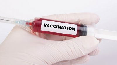 Syringe with label reading 'vaccination'
