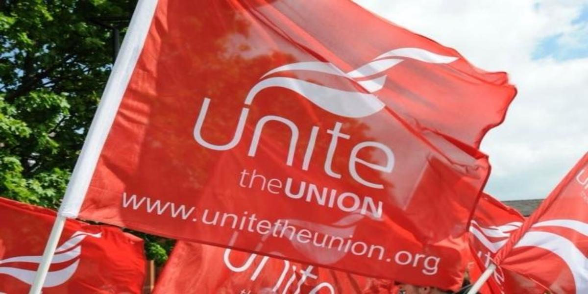 A red waving Unite the Union flag