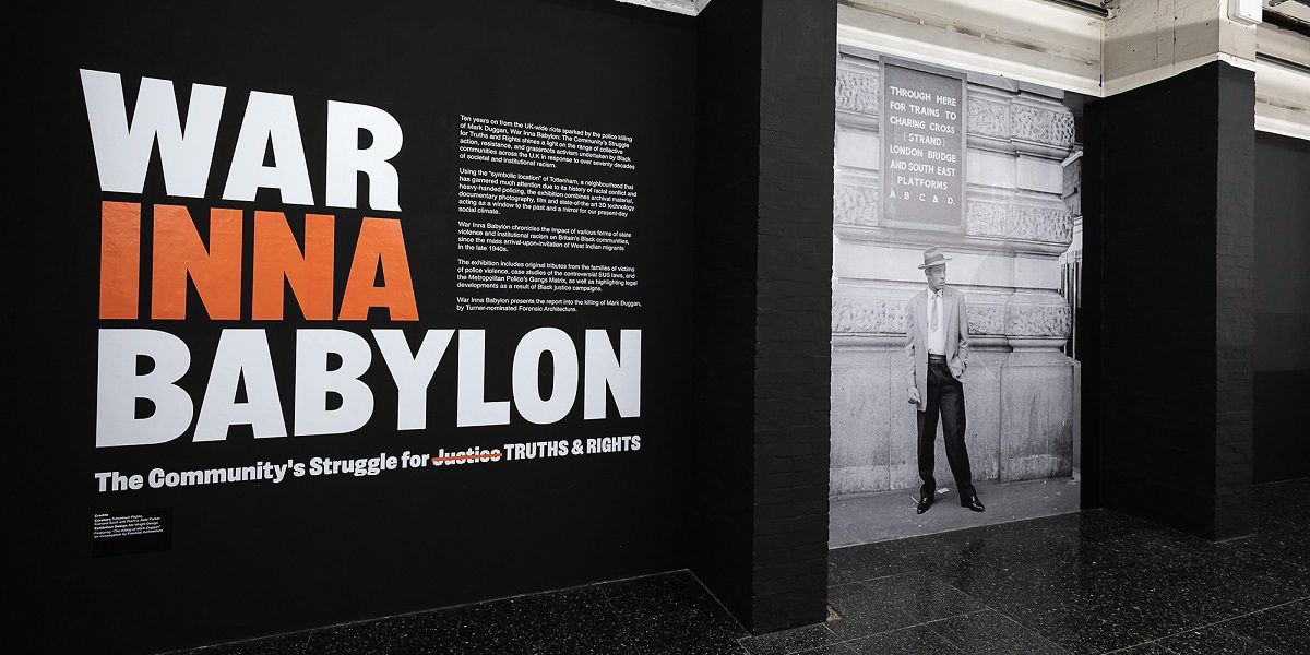 The opening interpretation of the exhibition reads in large text War Inna Banbylon with a black and white photo of a man from c. 1950s