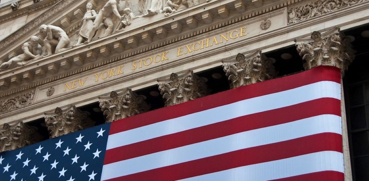 An American flag hung on the neoclassical facade of the New York Stock Exchange