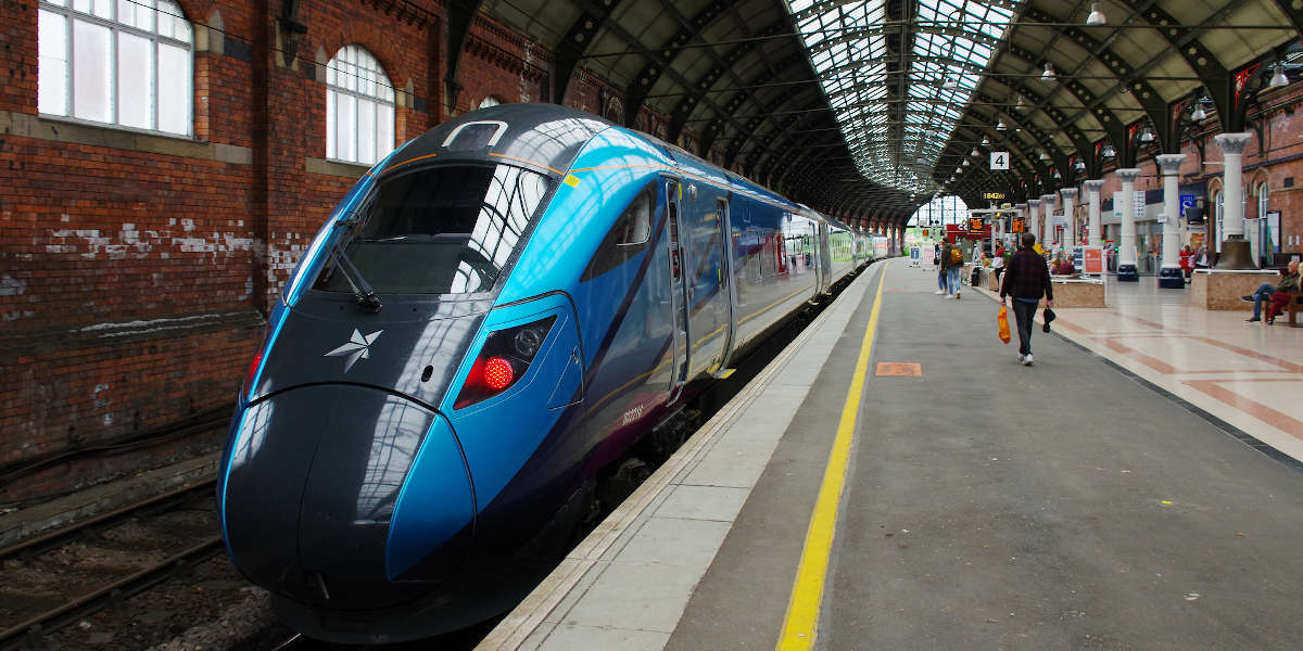 A Transpennine Express train stopped at a platform in Darlington Railway Station