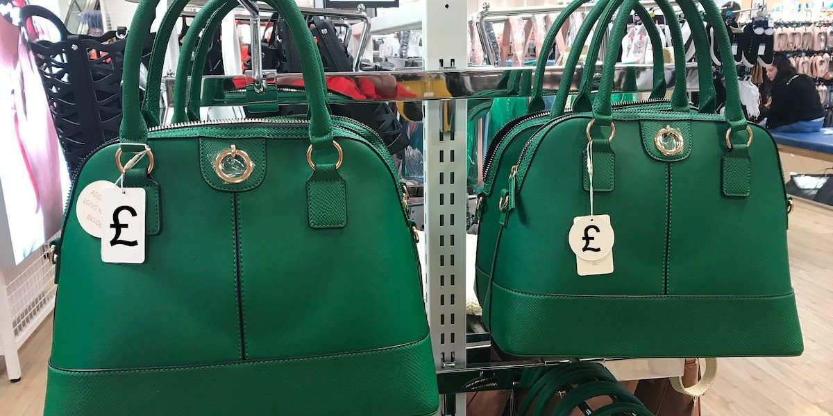 Handbags in a shop with pound sign tags