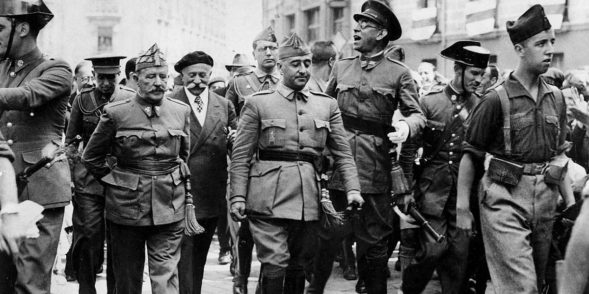 Spanish dictator walking alongside military colleagues in the Spanish city of Burgos in 1936