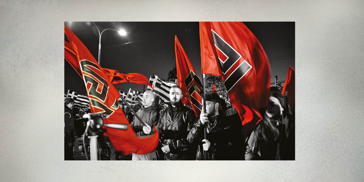 Supporters of the neo-Nazi Golden Dawn party wave red flags