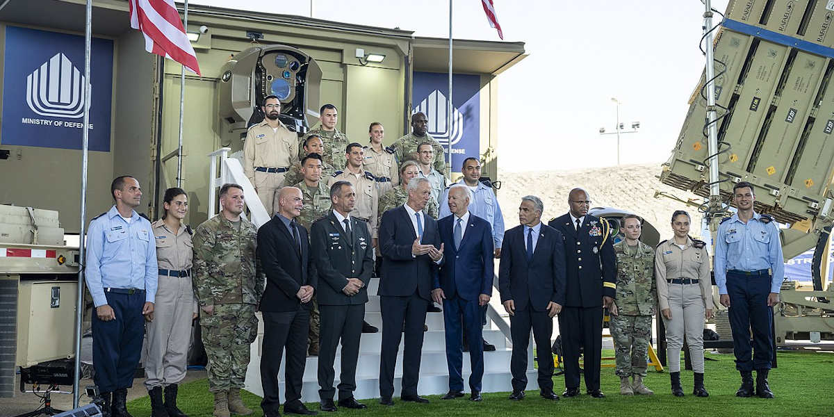 A group of politicians, diplomats and military officials standing in a row for a photograph for US President Joe Biden's visit to Israel's Department of Defence