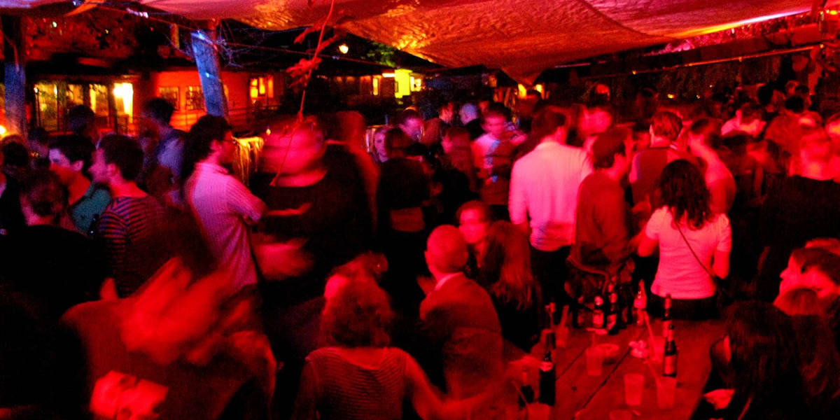 A blurry photograph of the interior of a nightclub