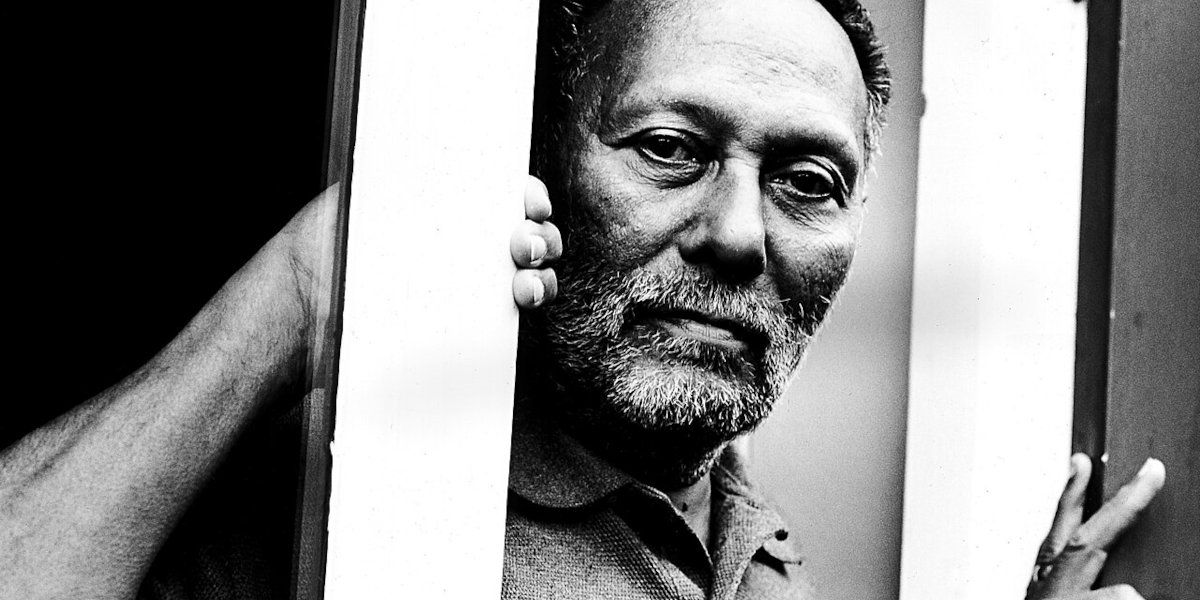 A black and white photograph of cultural theorist Stuart Hall