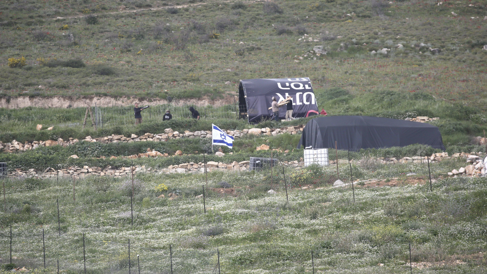 Zionist colonisers install a shepherding outpost and Israeli flags to seize Palestinian land outside Nablus
