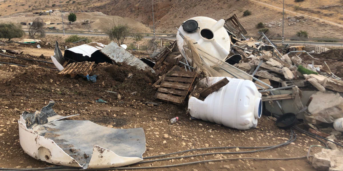 Destroyed structures including a water tank